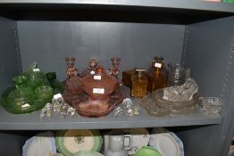 A selection of clear cut and colour glass dressing table sets including pink green and brown