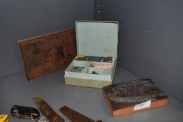 Two vintage printing plates and a Dennisons letter wax set.