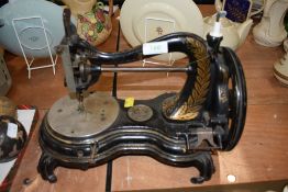 An antique Jones crank handled sewing machine.