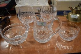 A collection of Waterford including two bowls, a jug and two glasses.