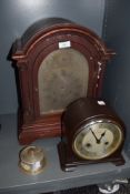 An early plastic Enfield chiming mantel clock and similar wooden cased mantel clock with bevelled