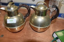 Two plated arts and crafts coffee pots,both hold a pint and have leather insulated handles, one