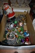 A selection of vintage Christmas decorations including novelty Santa