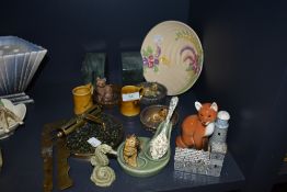 A collection of Wade and similar included are cats and dogs in baskets, a seahorse pipe rest with