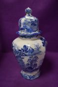 A large vintage blue and white lidded jar or urn, some colour restoration in places.