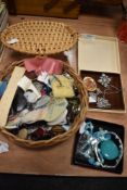 A wickers box of buttons and haberdashery and some costume jewellery.