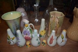 A selection of cruet sets and salt and peppers including hand decorated