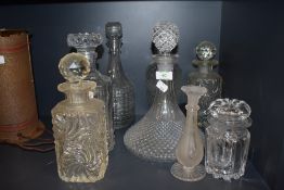 Six vintage pressed glass decanters or varying size and style and similar items, good condition.