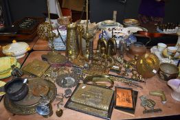 A good selection of brass wares including a pair of antique Lucerne oil lamps bugles perpetual