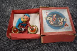 A 1930's Triang tin plate Gyro Cycle, in original box