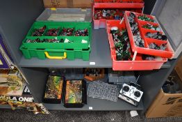Two shelves of Games Workshop Warhammer plastic and painted metal figures and accessories along with
