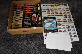 A box containing Thirty Two Days Gone, Vanguards, Pepsi Cola and similar diecasts, all boxed, aong