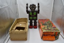 A 1960's Horikawa S H (Japan) battery operated tinplate 'Attacking Martian' Robot, in original
