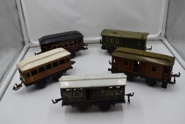Five Bing and similar tin plate 0 gauge Four Wheel Coaches and Wagons