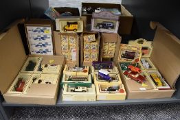 A shelf of Lledo Days Gone and similar diecasts, all boxed along with a Corgi Oldsmobile Tornado and