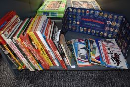 A shelf of mixed vintage Football Annuals and Matchday Programmes including Shoot, All Stars,