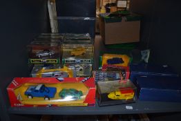 A shelf of modern diecasts, Corgi , Schuco and Cararama including Queen Mothers Century Bus,