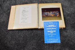 A Leyland Motors FC album containing Ephemera and Photographs from the Inaugural Floodlight Math