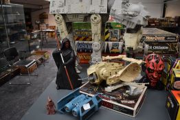 A collection of Star Wars accessories including At-At, All Terrain Scout Vehicles, Darth Maul Figure