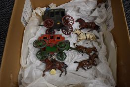 A JoHillCo and a Cresent Lead Stage Coach with Two Horses along with a Britains Lead Cowboy on