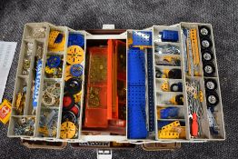 A folding box of Meccano and booklets including Crane Construction, Booklets 2/3/4 silmilar period
