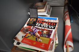 A selection of Manchester United memorabilia including 1983 FA Cup Final Flag, modern badges,