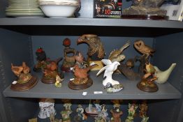 A selection of bird figurines including Royal Doultn doves.