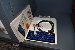 A vintage Sinclair ZX 80 computer with manuals