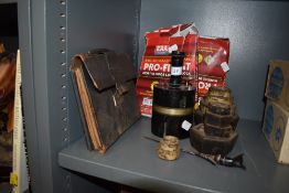 A vintage writing case a selection of weights a letter opener and part of what is believed to be