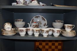 A vintage Colclough bone china part dinner service having transfer floral motif pattern including
