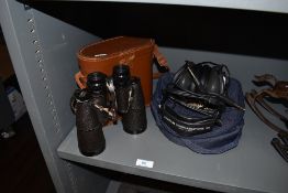 A set of JT Coppock Binoculars and a Aviation communications head set.