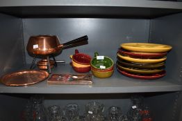 A selection of as new fondue items including burner bowls and plates