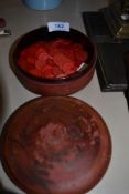 A selection of early red dyed bone games counters or pieces
