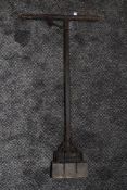 A vintage agricultural tool or similar.