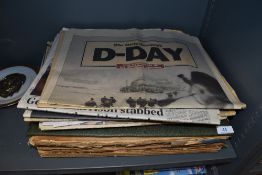A selection of collectable newspapers with various famous headlines from the past