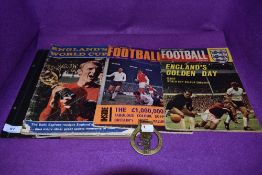 Four 1960s football magazines and a 1966 world cup brass.