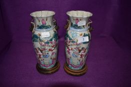A pair of Chinese or similar vase having famille rose decoration