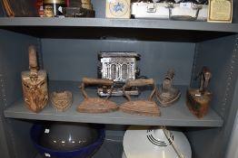 A late 1920s/30s toaster and a selection of antique flat irons.
