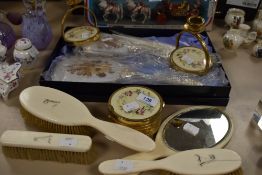 An assortment of vintage dressing table items including brushes, trinket boxes and candle stick