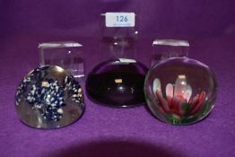 six paper weights, mixed styles,colours and designs.
