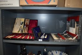 A selection of vintage canteens of cutlery including fish knifes and forks.