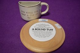 Two novelty items, one being a half cup 'you asked for half a cup of tea' and the other 'A Round