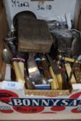 A mixed box of vintage cutlery including plated ware, knife rests, ladles and salad servers