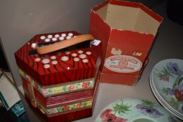a boxed musical squeeze box or concertina