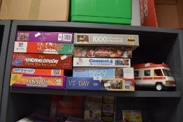 A selection of childrens puzzles and games also Playmobile Ambulance