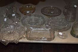 An assortment of predominantly vintage pressed glass and similar including cake stands, jugs, dishes