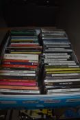 A box full of CD's , a real mix of genres ranging from funk and disco to rock , jazz and classical.