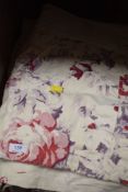 A large antique patchwork quilt, damage/wear and repairs throughout.
