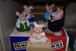 A selection of boxed Wade pig figure money boxes