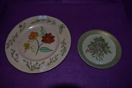 Two hand painted display plates one by Z. Carter 1955 for Royal Doulton and smaller M. Pool Empire